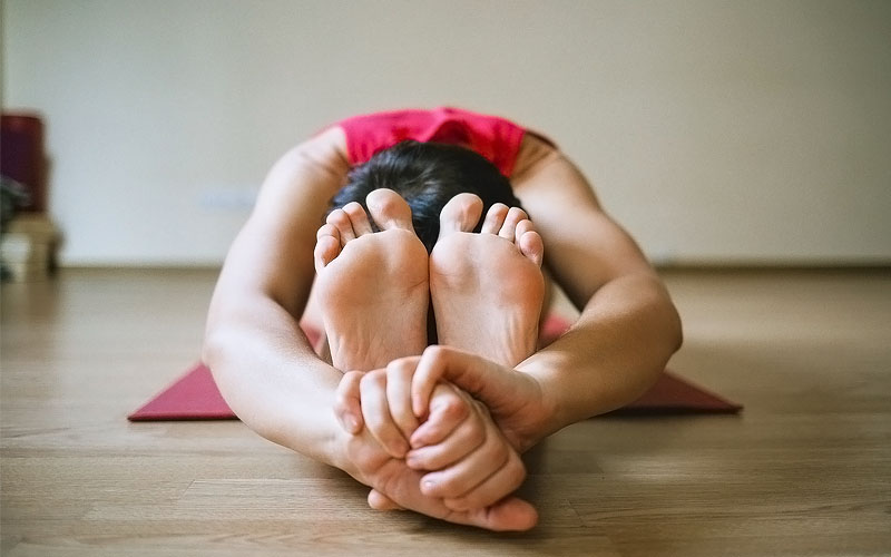 a person doing yoga for benefits in sleep
