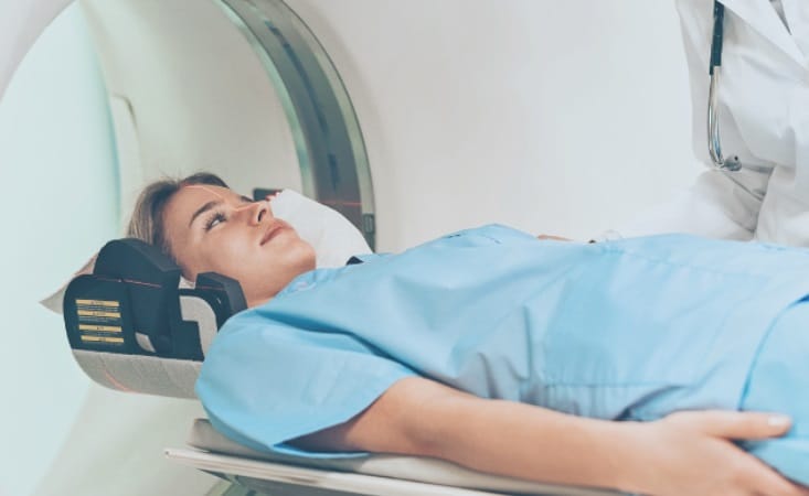 a woman getting MRI scanned