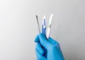 clean surgical tools in hand