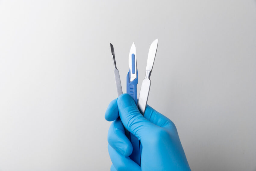 clean surgical tools in hand