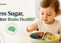 Child eating a healthy snack, illustrating research linking lower sugar intake in early childhood to better brain health later in life.
