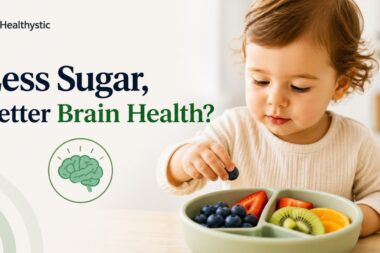 Child eating a healthy snack, illustrating research linking lower sugar intake in early childhood to better brain health later in life.
