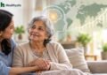 Older woman holding hands with an adult family caregiver at home